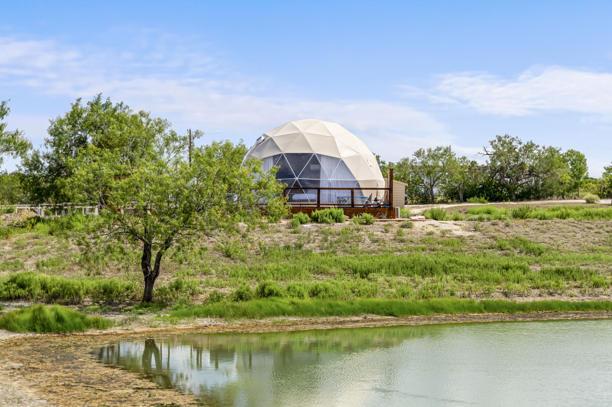 Geodesic dome overlooking the pond at The Farm Texas