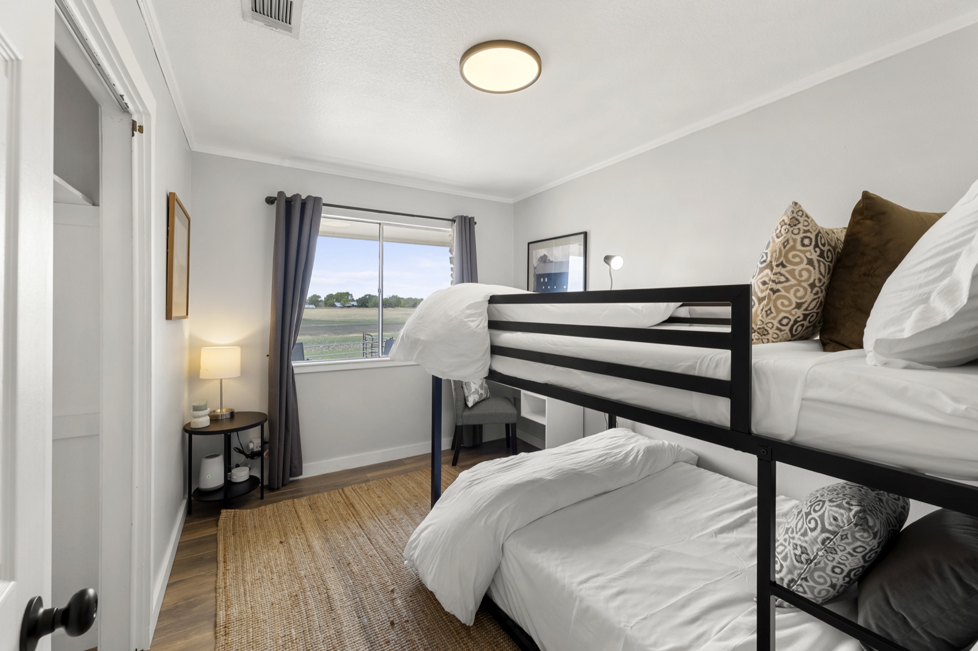 Bunk bed room perfect for kids with farm views